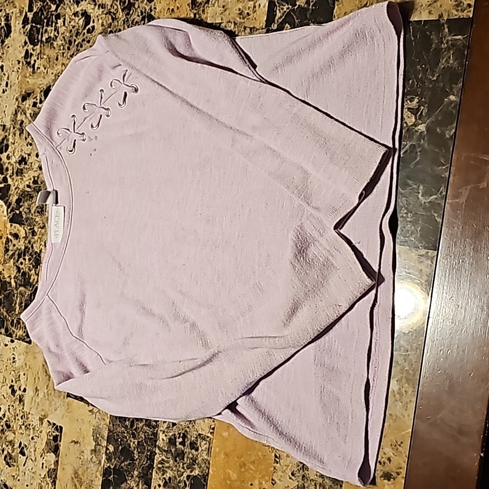 Children place sweater